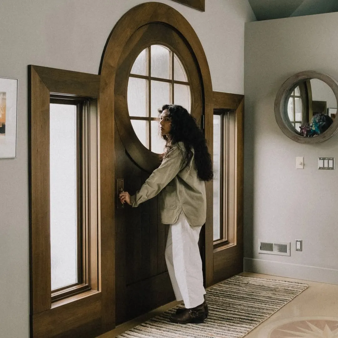 A Women Opening the Door