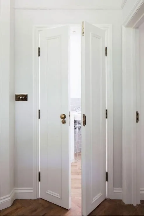 Bi Fold Doors Adorned With Brass Door Knobs
