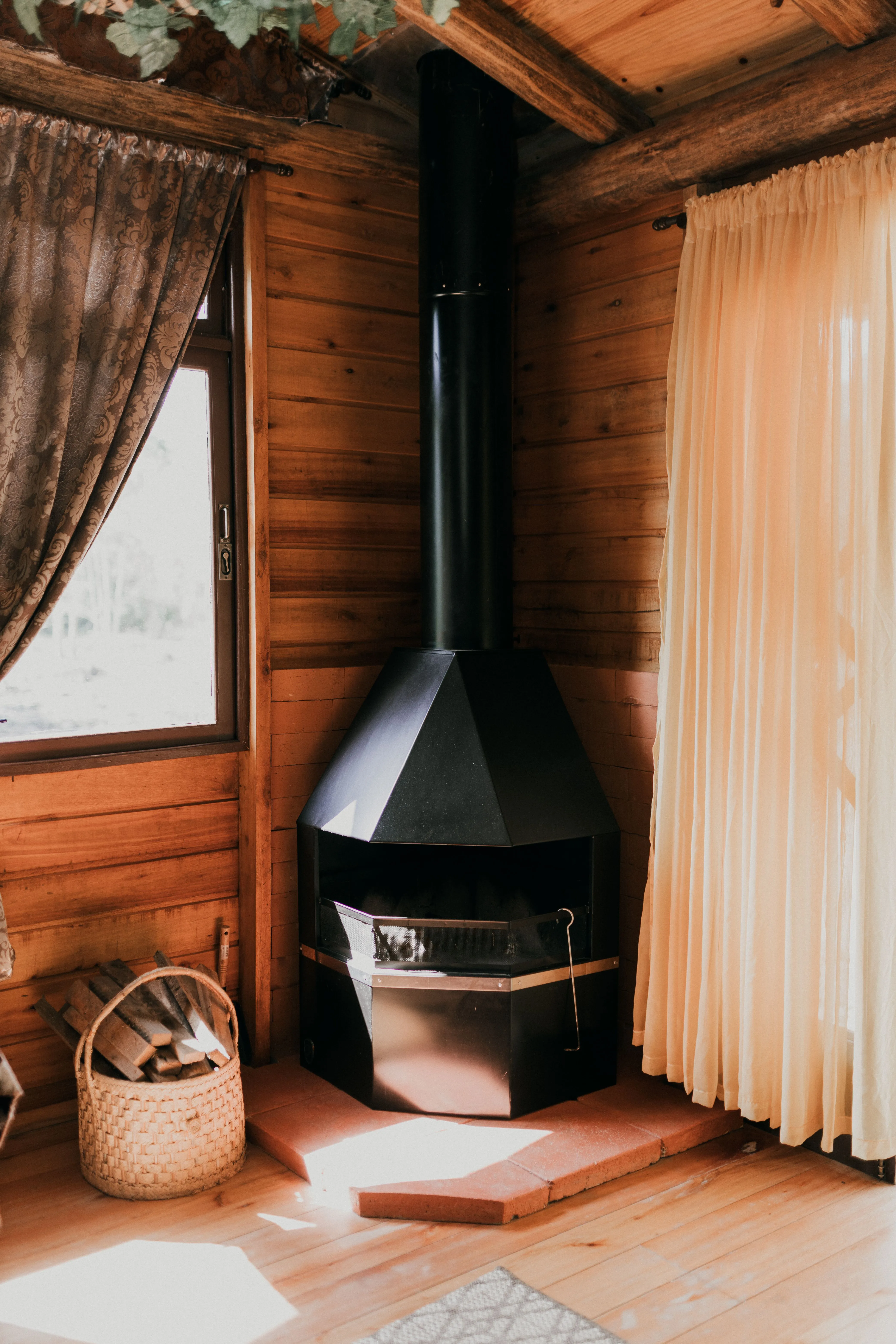 A Iron Stove Placed at the Corner of the Wooden Home