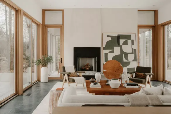 Modern living room with fireplace and large windows